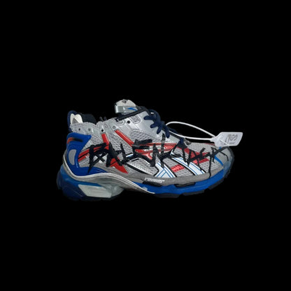 Balenciaga Runner Sneakers featuring a bold design with red and blue accents on a silver base.