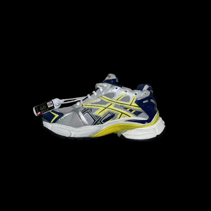Distressed Running Sneakers in gray fabric with navy and yellow accents showcasing a bold contemporary style.