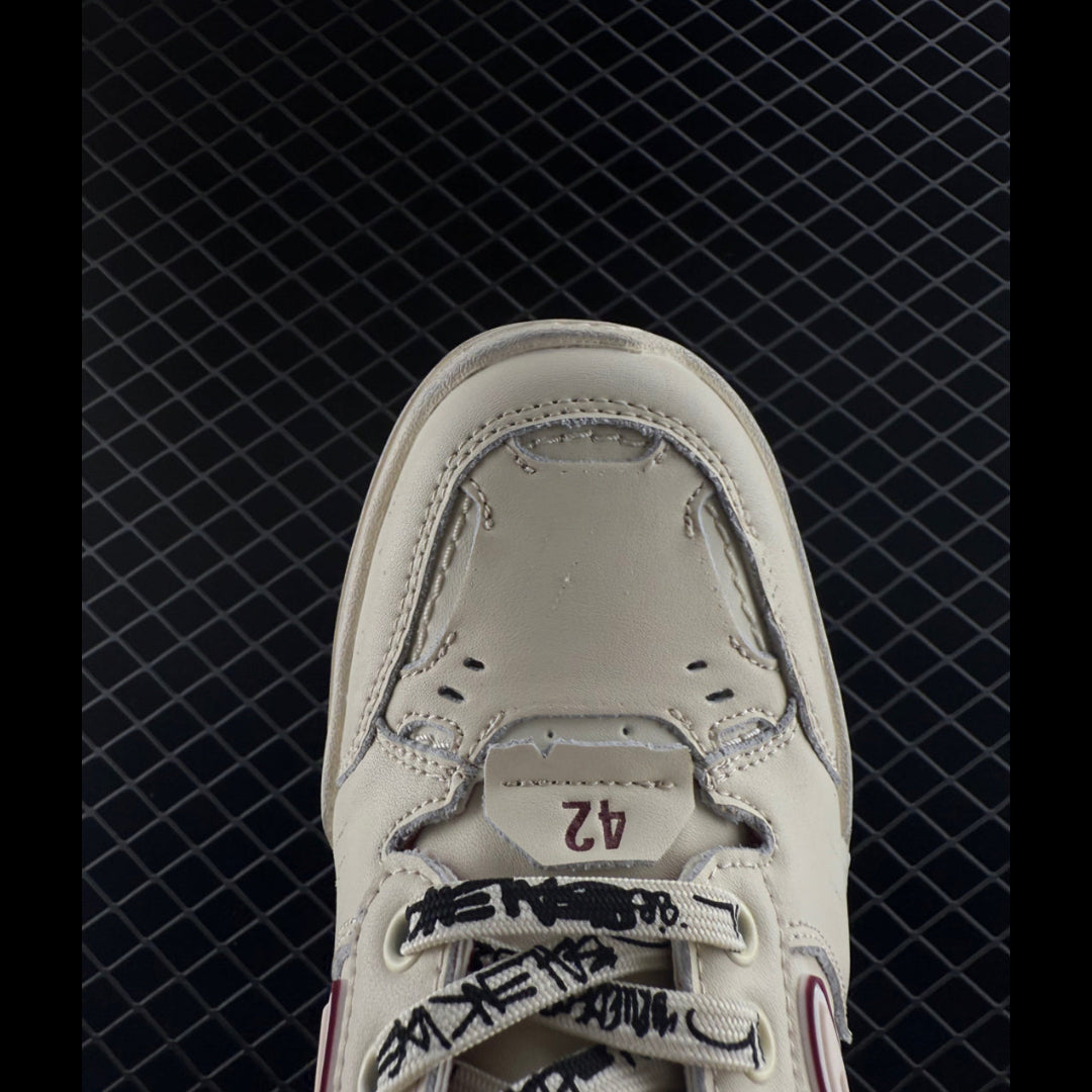 Hamptons Contemporary Sneakers in a clean, white design with distinctive side detailing, perfect for streetwear styling.