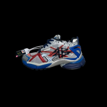 Balenciaga Runner Sneakers featuring a bold design with red and blue accents on a silver base.