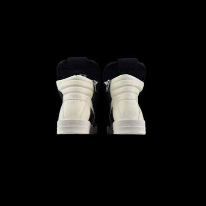 Oversized High-Top Sneakers in black and white with bold high-top silhouette and signature oversized detailing.