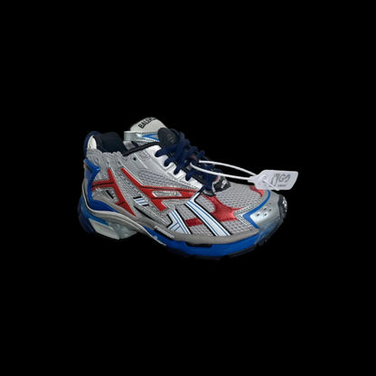 Layered Balenciaga Runners in silver, red, and blue with premium design and bold aesthetic.